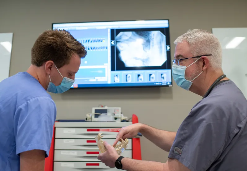 Doctor teaching student